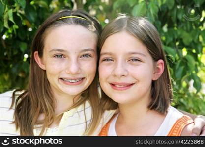 Portrait of two beautiful school girls who are best friends.