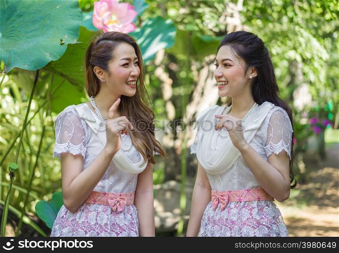 portrait of two beautiful young woman in Thai traditional dress