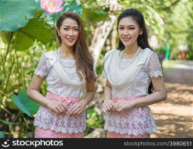 portrait of two beautiful young woman in Thai traditional dress