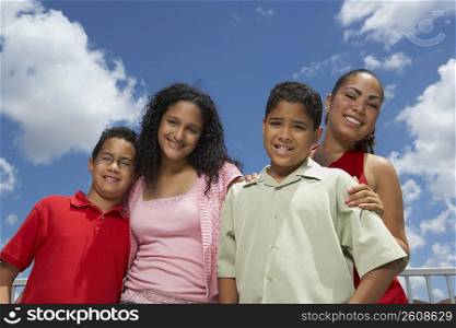 Portrait of two boys and two teenage girls smiling