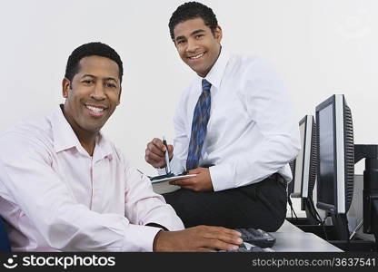 Portrait of two business men in office