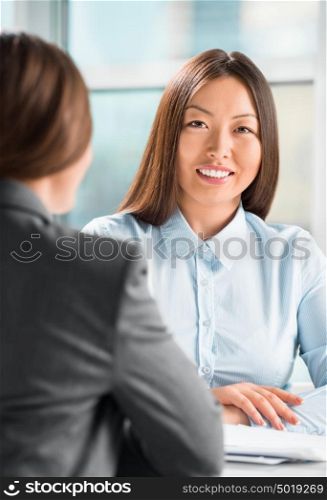 Portrait of two business women meeting at office