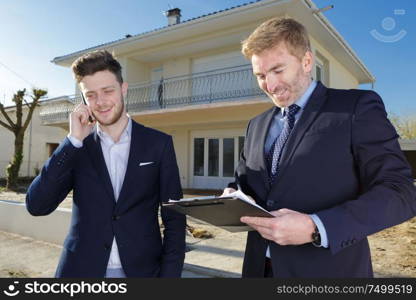 portrait of two businessman meeting outdoor