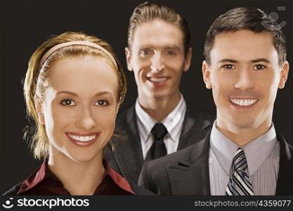 Portrait of two businessmen and a businesswoman smiling