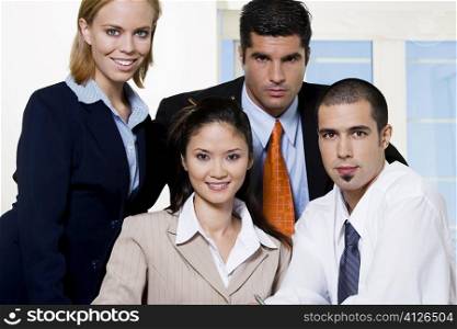 Portrait of two businessmen and two businesswomen
