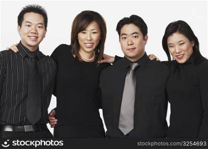 Portrait of two businessmen and two businesswomen smiling