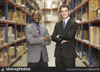 Portrait Of Two Businessmen In Warehouse