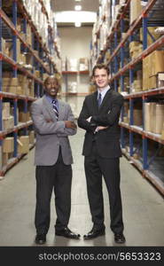 Portrait Of Two Businessmen In Warehouse