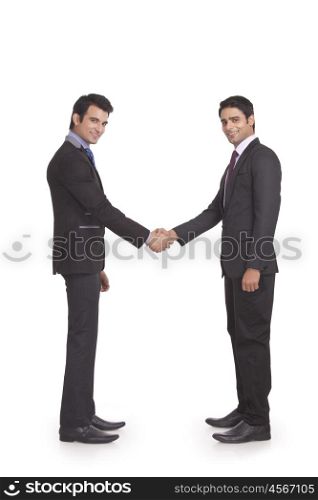 Portrait of two businessmen shaking hands