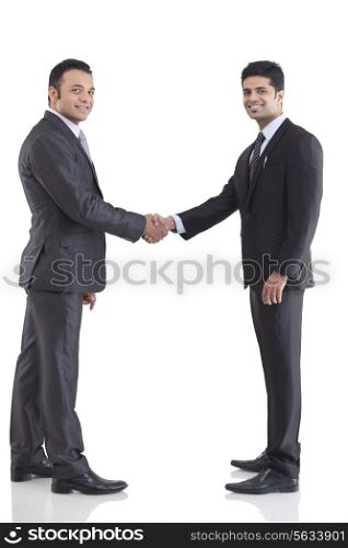 Portrait of two businessmen shaking hands