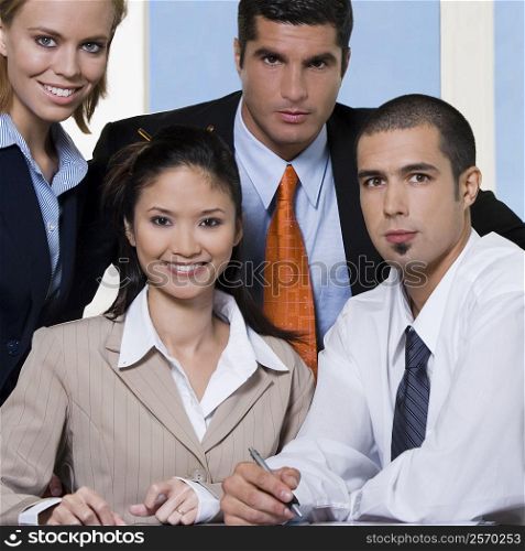 Portrait of two businesswomen and two businessmen in an office