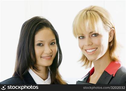 Portrait of two businesswomen smiling
