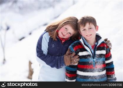 Portrait Of Two Children In Snowy Landscape