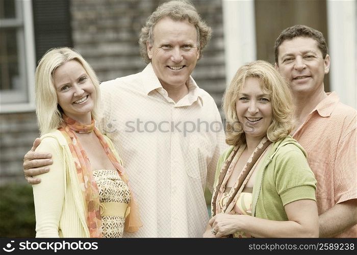 Portrait of two couples smiling together