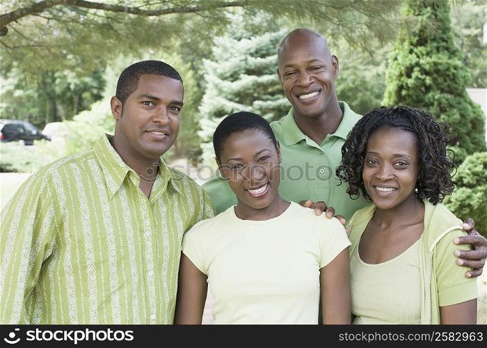 Portrait of two couples standing together and smiling