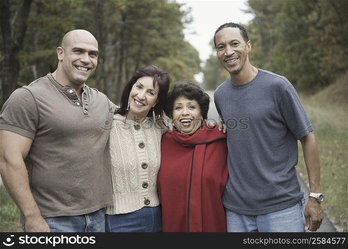 Portrait of two couples standing together and smiling