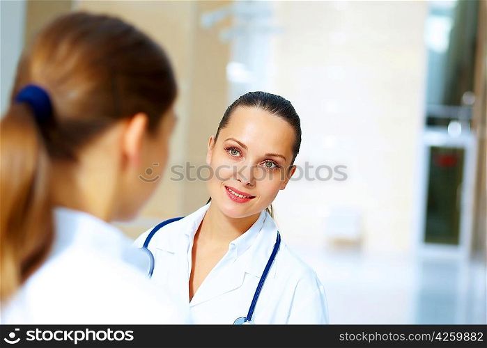 Portrait of two friendly female doctors