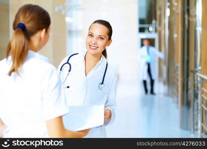 Portrait of two friendly female doctors