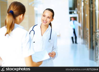 Portrait of two friendly female doctors