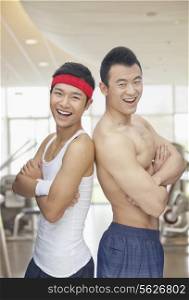 Portrait of two friends at the gym