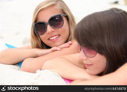 portrait of two girls on the beach