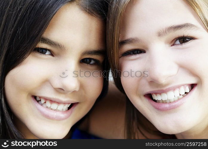 Portrait of two girls smiling