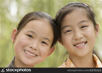 Portrait of two girls smiling