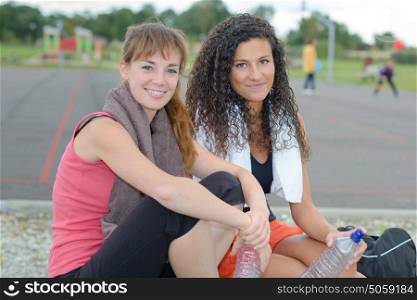 Portrait of two ladies resting after exercising