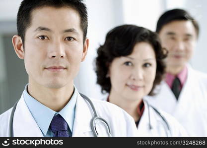 Portrait of two male doctors with a female doctor