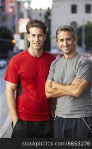 Portrait Of Two Male Runners On Urban Street