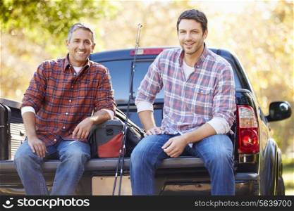 Portrait Of Two Men In Pick Up Truck On Camping Holiday