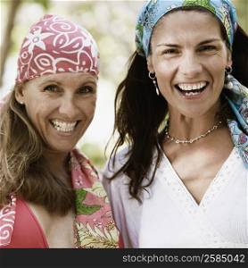 Portrait of two mid adult women smiling