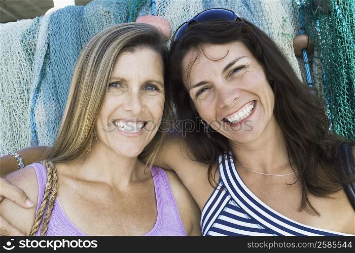 Portrait of two mid adult women smiling
