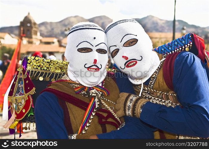 Portrait of two people wearing traditional costumes, Cuzco, Peru