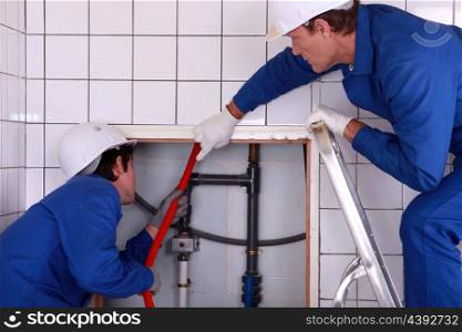 portrait of two plumbers