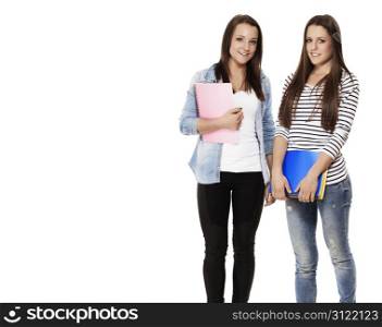 portrait of two students with note pads. portrait of two pretty student teenagers with note pads on white background