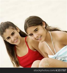 Portrait of two teenage girls sitting together