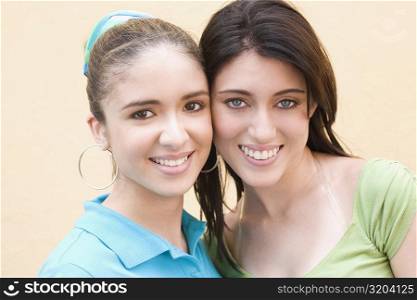 Portrait of two teenage girls smiling