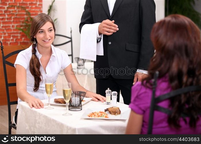 portrait of two women at restaurant