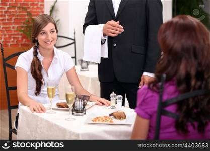 portrait of two women at restaurant