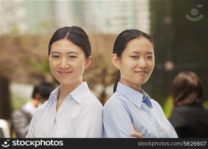 Portrait of two young businesswomen in Beijing