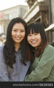 Portrait of two young friends in Beijing outdoors
