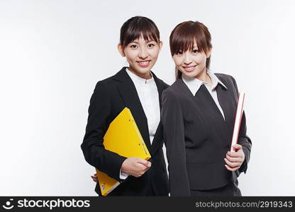 Portrait of two young girl in business suit