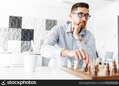 Portrait of two young man playing chess . Portrait of two young man playing chess in office