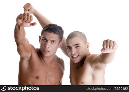 Portrait of two young men showing their fists
