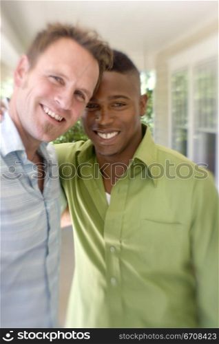 Portrait of two young men smiling