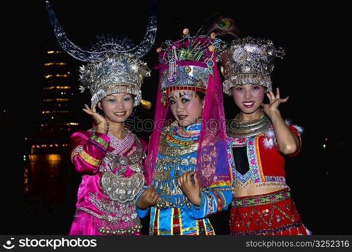 Portrait of two young women and a teenage girl smiling, Guilin, Guangxi Province, China