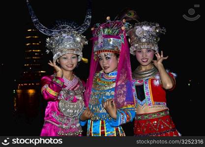 Portrait of two young women and a teenage girl smiling, Guilin, Guangxi Province, China