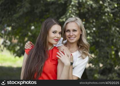 Portrait of two young women blonde and brunette