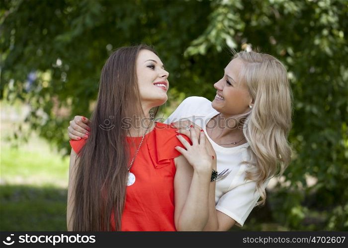 Portrait of two young women blonde and brunette